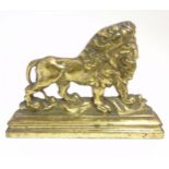 A 19thC cast brass door porter / doorstop with lion decoration.