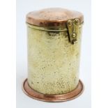 Arts and crafts brass and copper cylindrical hinged lidded tea caddy.