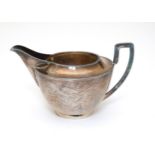 Chinese Export Silver : A silver jug with dragon decoration marked under ' TACKHING 90% SILVER '