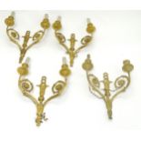 A set of 4 late 18th / early 19thC wall sconces: a set of 4 double branch gilded (ormolu) wall