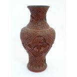 A Chinese c1900 cinnabar lacquer vase of baluster shape ,