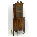 A late 19thC / early 20thC mahogany corner cabinet,