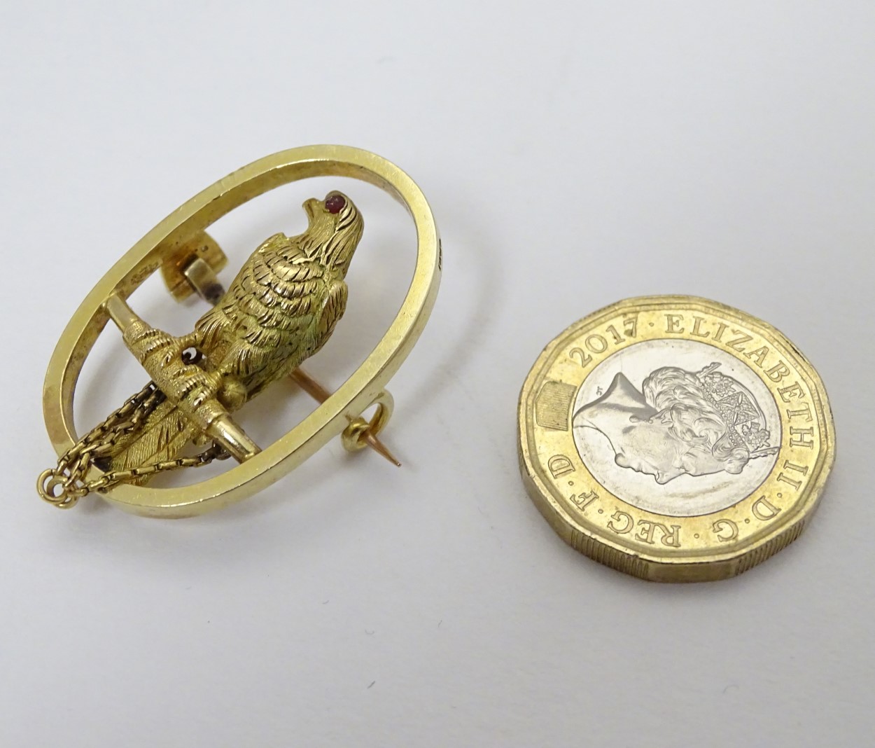 A 15ct gold brooch of oval form with falcon bird to centre 1 1/4" high CONDITION: - Image 4 of 5