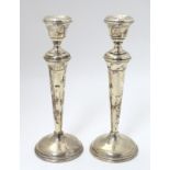 A pair of 20thC silver candlesticks. Maker Joseph Gloster Ltd.