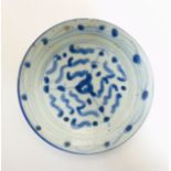 An Oriental, possibly Japanese small dish in underglaze blue,