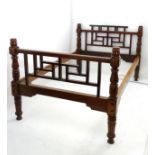 A late 19thC / early 20thC Anglo-Japanese double bed in the manner of E.