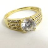 A 14ct gold ring set with white stones CONDITION: Please Note - we do not make
