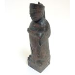 A carved Oriental soapstone figure of a man wearing decorated robe 7 3/4" high