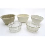 Jelly Moulds : 3 ceramic ( one marked under ) and 2 glass jelly moulds ,