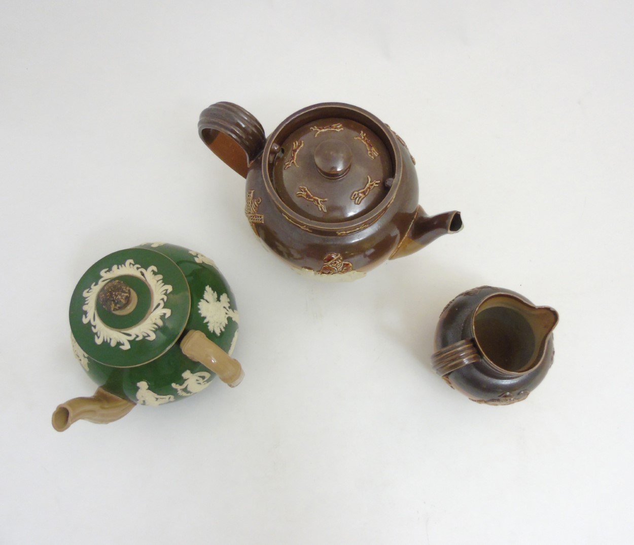 Three pieces of stoneware ceramics comprising a Royal Doulton salt glazed hunting teapot, - Image 7 of 9