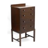 An Art Deco mahogany four drawer chest with graduated oak lined drawers,