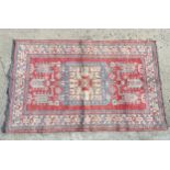 Rug / carpet : an unusual hand made carpet with beige ,blue and red colours ,