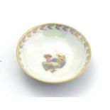 A Wedgwood fairyland lustre small dish with stylised rooster / cockerel decoration to centre,