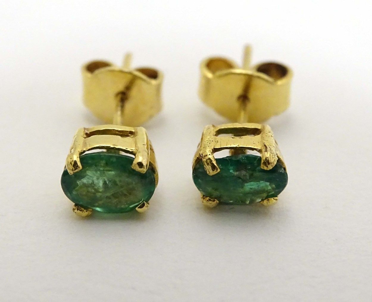 A pair of 9ct gold earrings set with emerald green stones CONDITION: Please Note - - Image 2 of 5