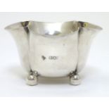 A silver sugar bowl on 4 ball feet. Hallmarked London 1909 maker Horace Woodward & Co Ltd.