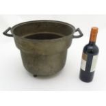 A 19 th C bronze large two handled cooking pot with three short legs ( Skillet style ) ,