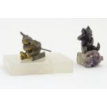 Gnomes : A white metal miner sat upon an amethyst rock.