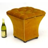 A Victorian Ottoman with golden upholstery and deep buttoned top,