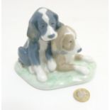 A Lladro 'Nao' figurine of two dogs, makers mark to base,