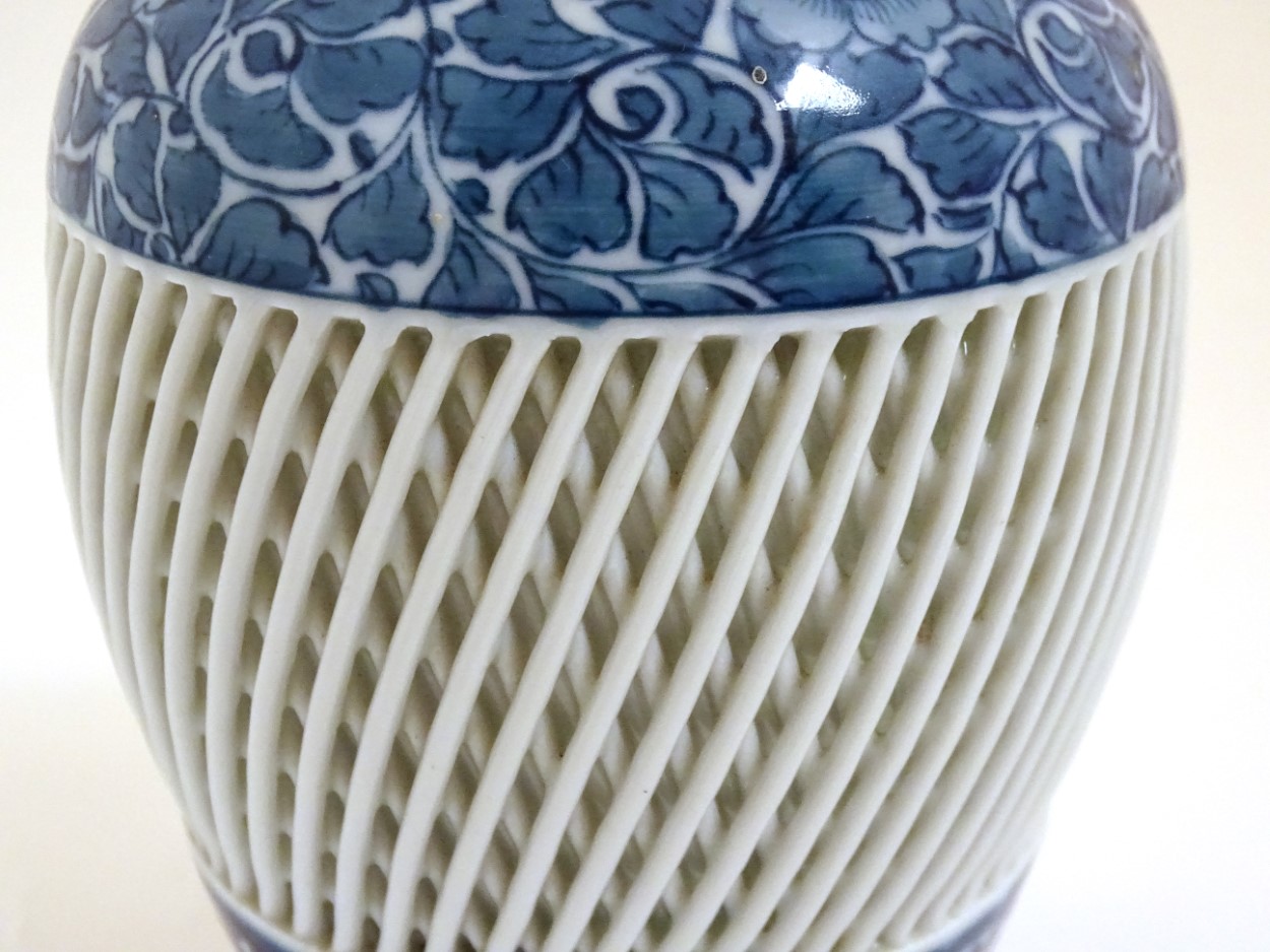 A blue and white Chinese baluster vase decorated with a floral pattern and a reticulated banded - Image 10 of 11