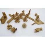 A quantity of carved Wooden toys comprising farm animals on a latticework,