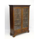 A 19thC Astral glazed mahogany cabinet with dentil cornice ,