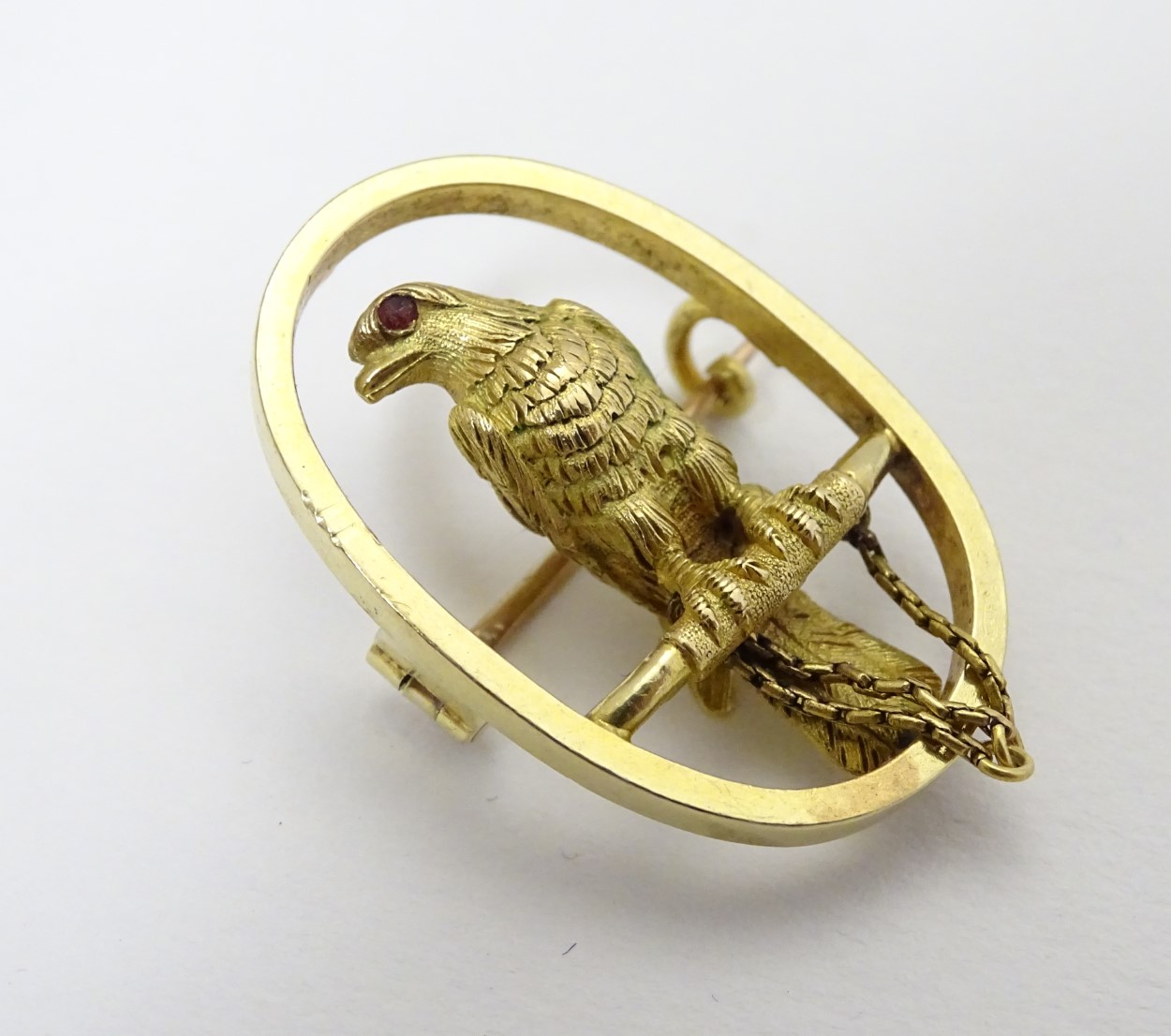 A 15ct gold brooch of oval form with falcon bird to centre 1 1/4" high CONDITION: - Image 5 of 5