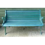 Garden bench : A 2 1/2 seat green painted bench with cast iron ends and wooden slats ,
