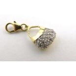 A 14ct gold pendant / fob formed as a basket set with white stones.