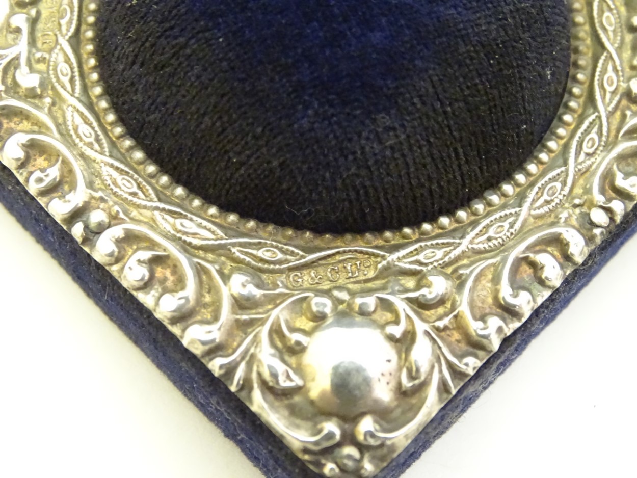 A blue velvet hat pin / pin cushion of squared form with domed centre and having embossed silver - Image 6 of 6