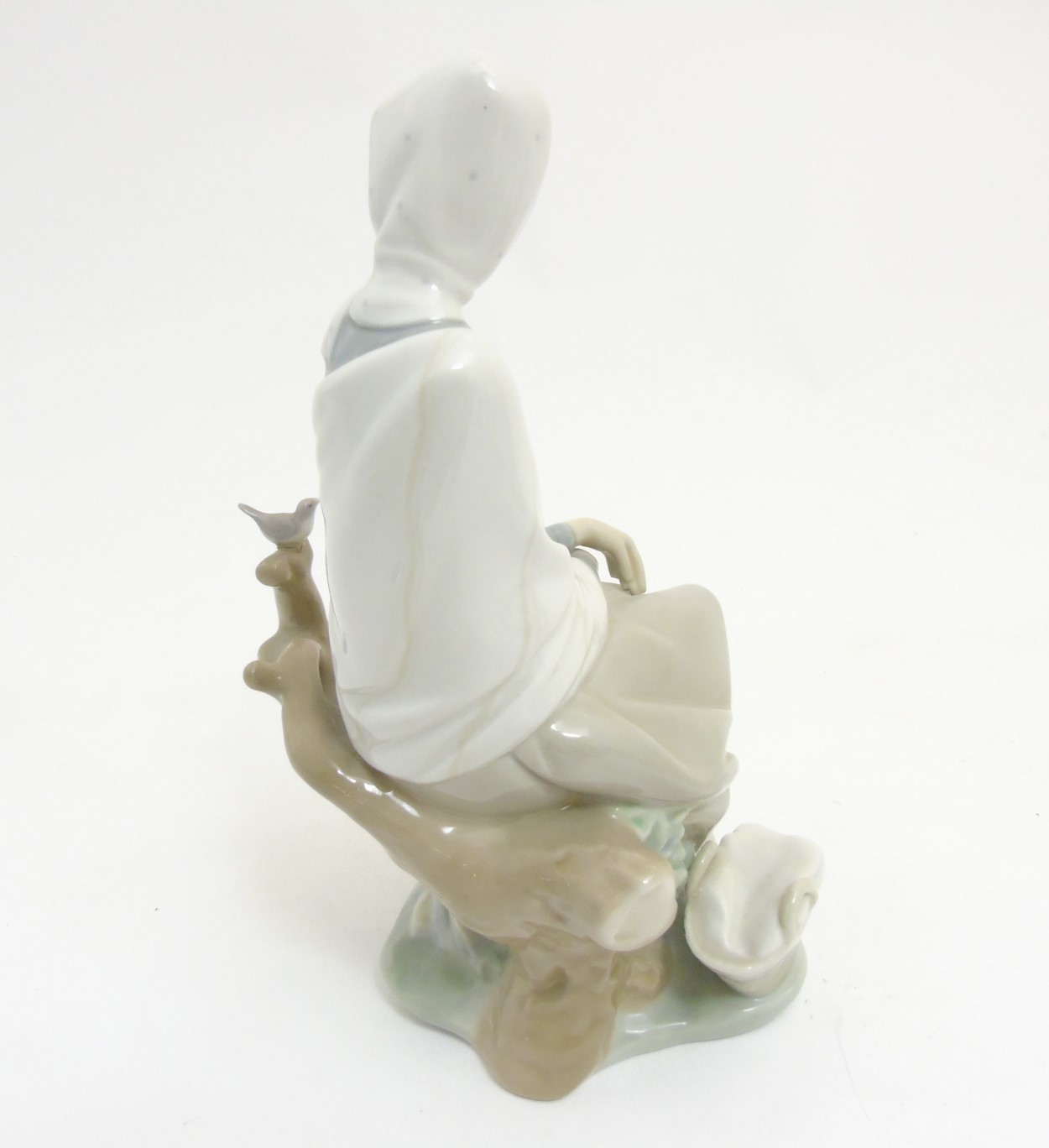 A Lladro 'New Shepherdess' figurine of a girl sat watching a bird, makers mark to base, - Image 5 of 8