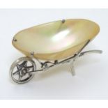 A silver and mother of pearl novelty table salt formed as a wheelbarrow hallmarked Birmingham 1909