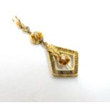 A 14k gold pendant set with diamonds.