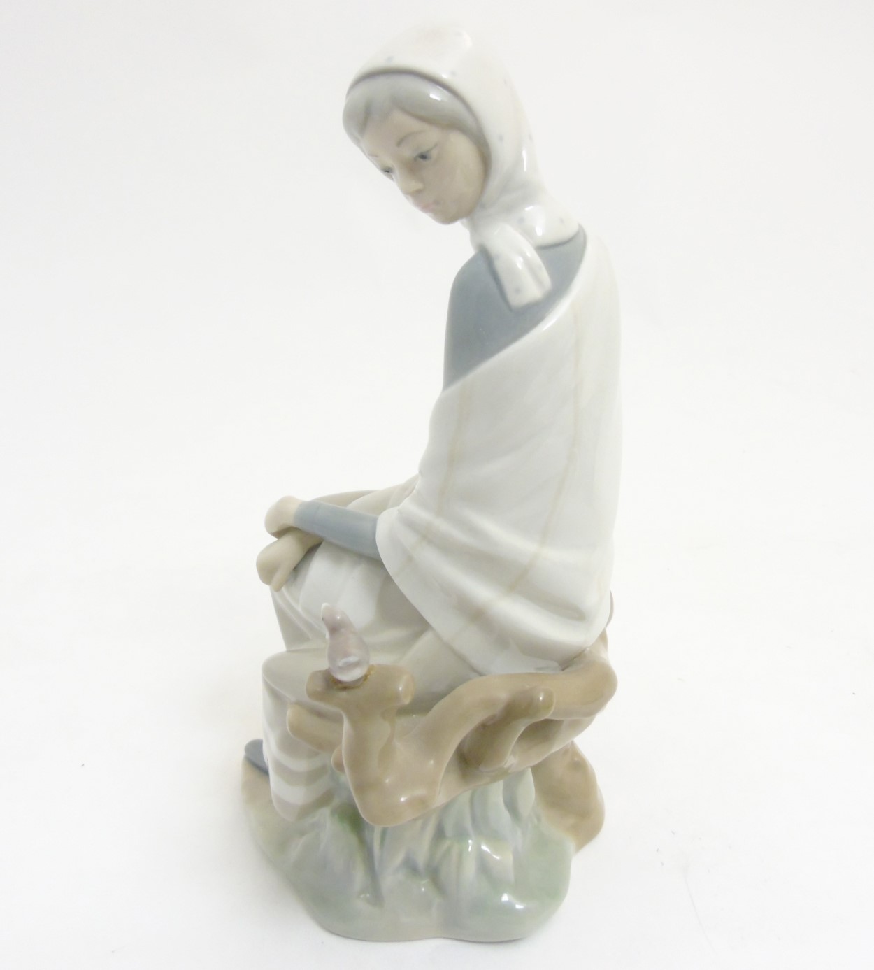 A Lladro 'New Shepherdess' figurine of a girl sat watching a bird, makers mark to base, - Image 6 of 8