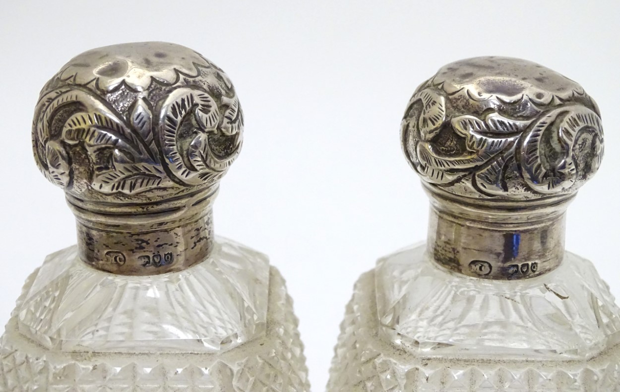 A pair of cut glass dressing table perfume / scent bottles with silver tops hallmarked London 1891 - Image 5 of 6