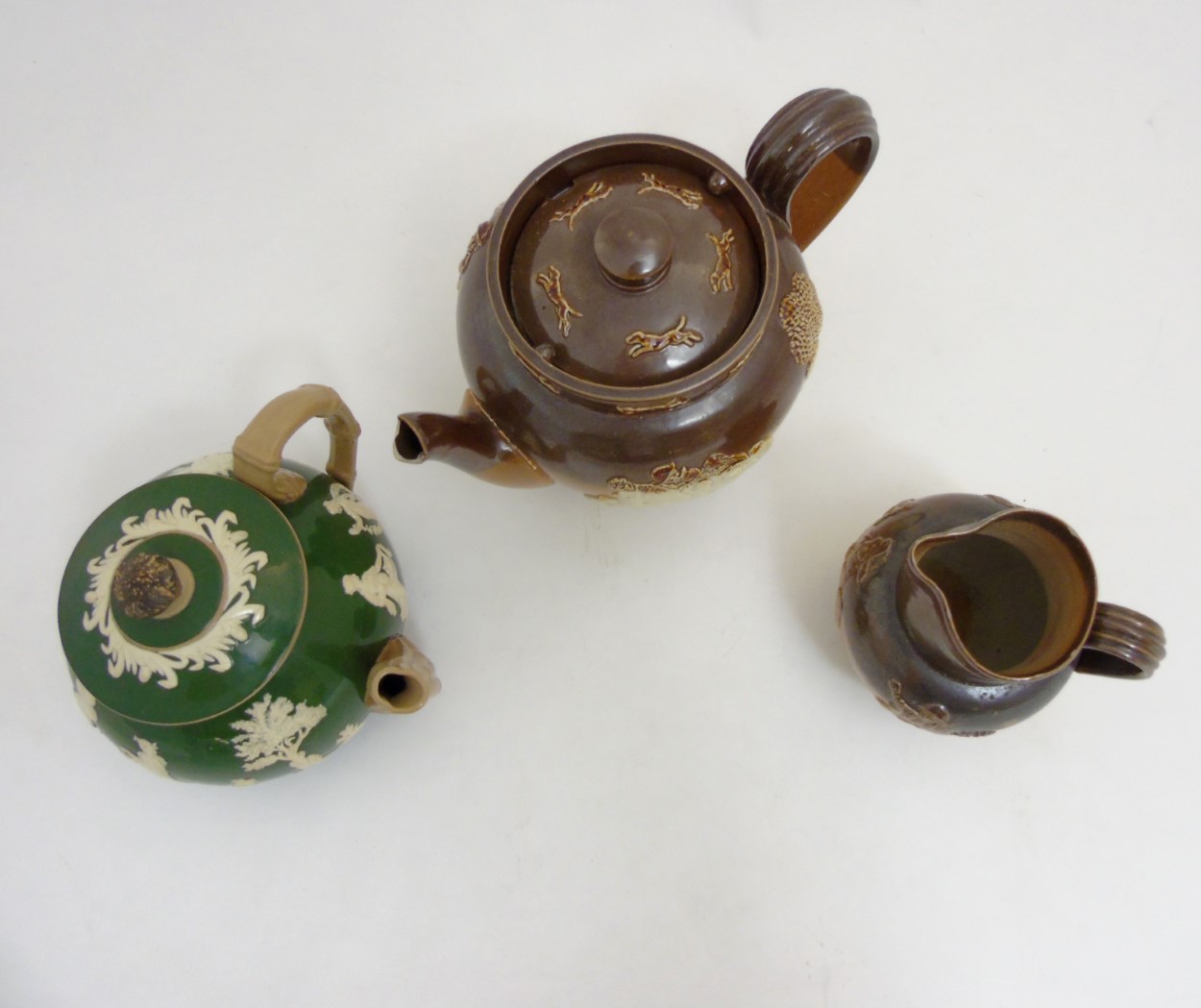 Three pieces of stoneware ceramics comprising a Royal Doulton salt glazed hunting teapot, - Image 4 of 9
