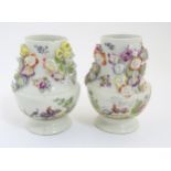 Two rare mid 18thC Derby flower encrusted vases of pear shape,