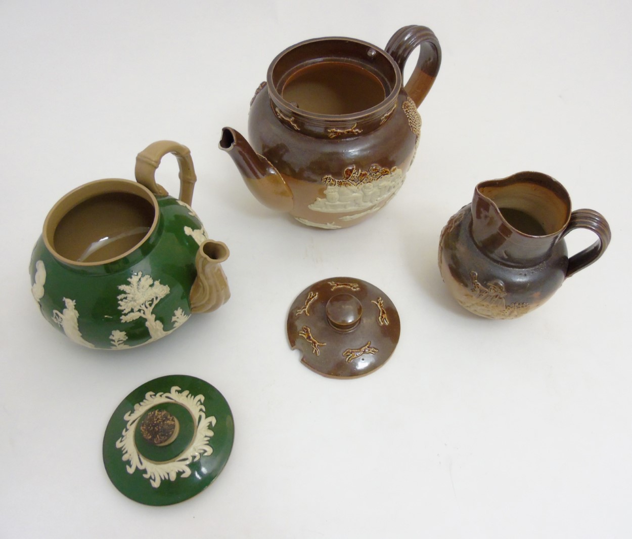 Three pieces of stoneware ceramics comprising a Royal Doulton salt glazed hunting teapot, - Image 5 of 9