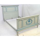 An early / mid 20thC painted Directoire style bed with floral swag and urn decoration,