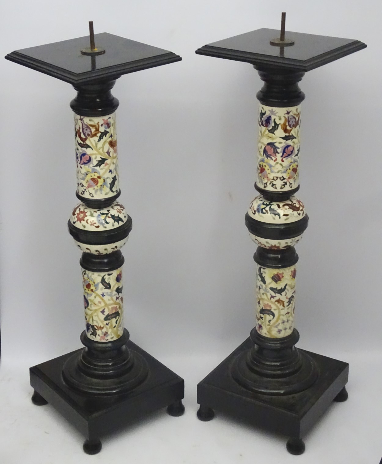 A pair of early 20thC columns/stands in the Zsolnay faience style,