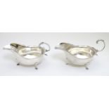 A pair of silver sauce boats hallmarked Birmingham 1927 maker Barker Brothers Silver Ltd.