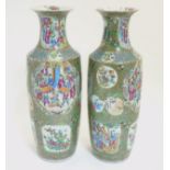 A pair of large Chinese Cantonese / Rose Medallion baluster vases,