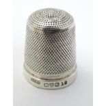 A silver thimble hallmarked Chester 1923 maker Henry Griffith & Sons Ltd.