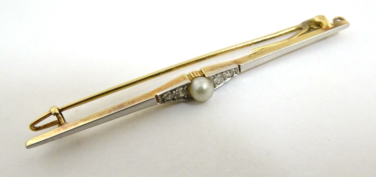 A yellow and white metal bar brooch set with central pearl flanked by diamonds. - Image 3 of 8