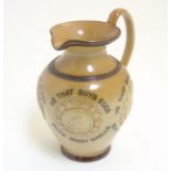 A late 19thC Doulton Lambeth stoneware 'he that buys' motto jug / pitcher,