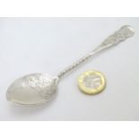 A silver preserve spoon with engraved decoration hallmarked Birmingham 1906 maker William