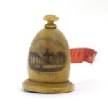 Mauchline ware : A Turned treen needlework / sewing tape measure decorated with image of Tenterden