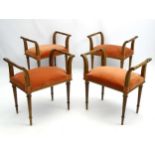 A set of four 19thC mahogany window seats, with fluted tapering legs and scrolled arms supports.