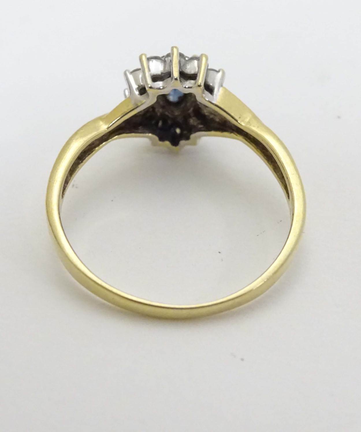 An 18ct gold ring set with central blue stone bordered by diamonds CONDITION: - Image 5 of 6