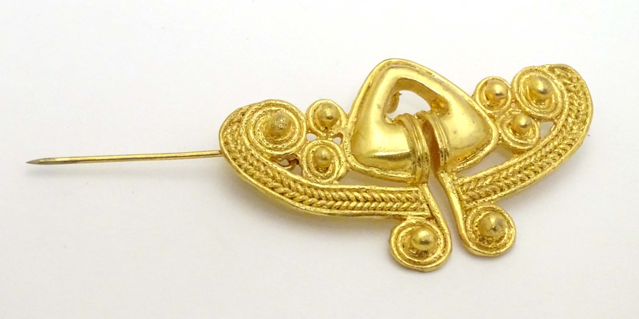 A gilt brooch of abstract form marked to reverse REU. - Image 6 of 6